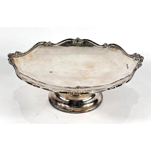 739 - A shaped circular hallmarked silver fruit dish with scrolled border and pedestal base, Sheffield 192... 