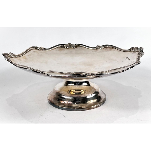 739 - A shaped circular hallmarked silver fruit dish with scrolled border and pedestal base, Sheffield 192... 