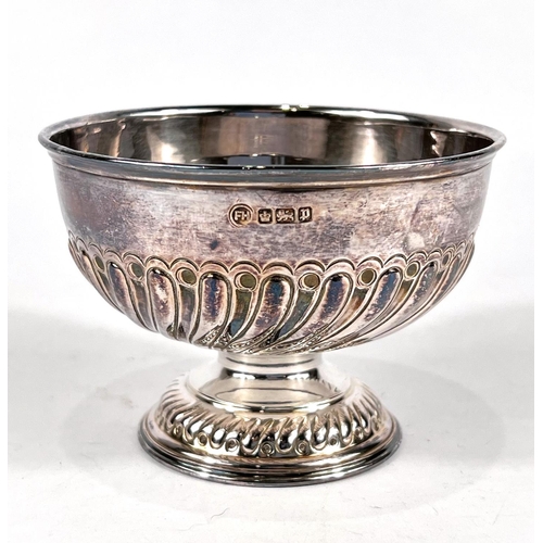 744 - A hallmarked silver circular pedestal bowl with gadrooned lower section, on circular foot, Sheffield... 