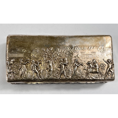 755 - A hallmarked silver rectangular box with embossed decoration of classical figures in procession, Che... 