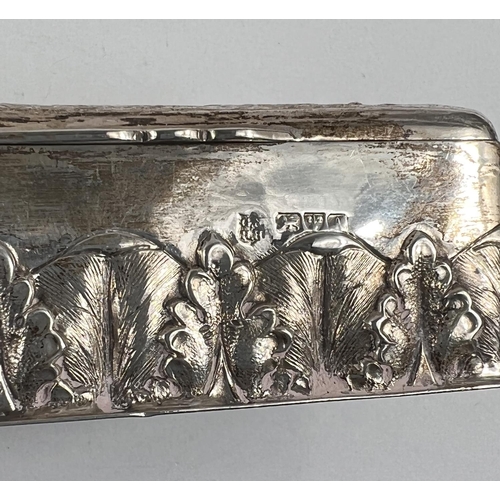 755 - A hallmarked silver rectangular box with embossed decoration of classical figures in procession, Che... 