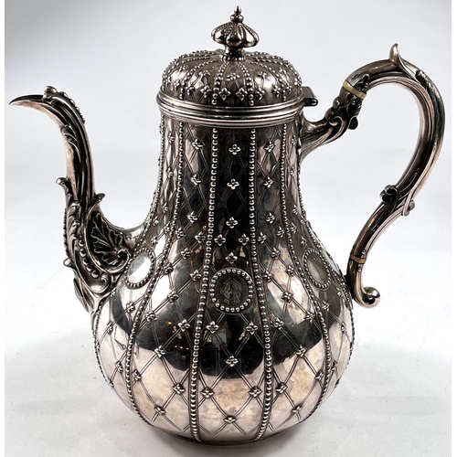 757 - A 19th century hallmarked silver baluster coffee pot, crested and with extensive beaded decoration, ...