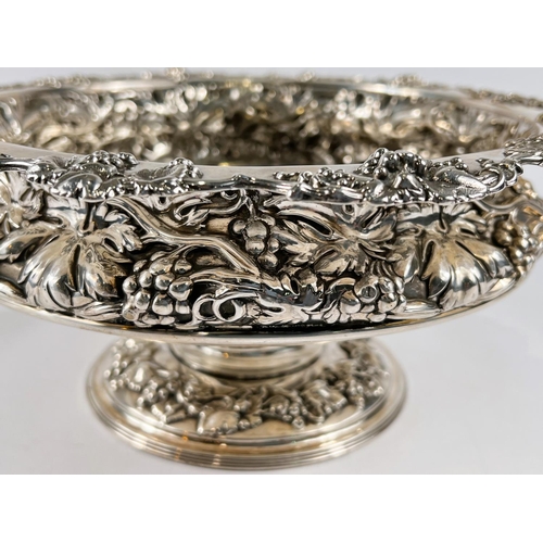 759 - A hallmarked silver circular rose bowl on pedestal base, with relief decoration of fruiting vines, S... 