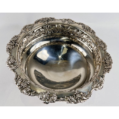 759 - A hallmarked silver circular rose bowl on pedestal base, with relief decoration of fruiting vines, S... 