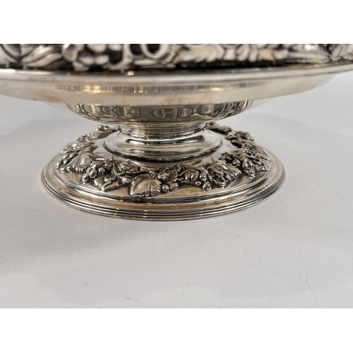 759 - A hallmarked silver circular rose bowl on pedestal base, with relief decoration of fruiting vines, S... 