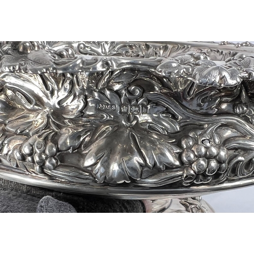 759 - A hallmarked silver circular rose bowl on pedestal base, with relief decoration of fruiting vines, S... 