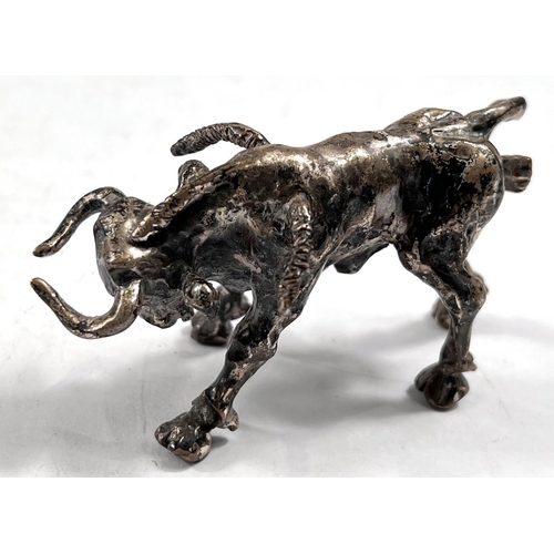 762 - A cast white metal matador and bull, one with foreign marks, length of bull 8cm