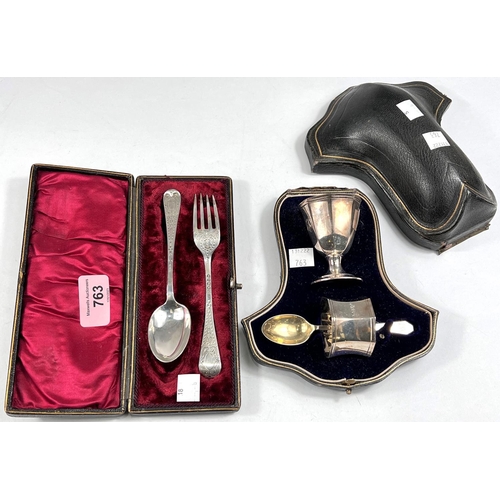 763 - A hallmarked silver 3 piece cased christening set:  egg cup, napkin ring and spoon, London 1912... 