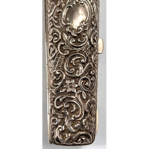 765 - A vial container with hinged body, heavily embossed decoration, Chester 1899, length 9cm, 3.7oz