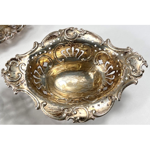 766 - A hallmarked silver oval bonbon dish, embossed and pierced, Chester 1898; another, stamped 'Sterling... 