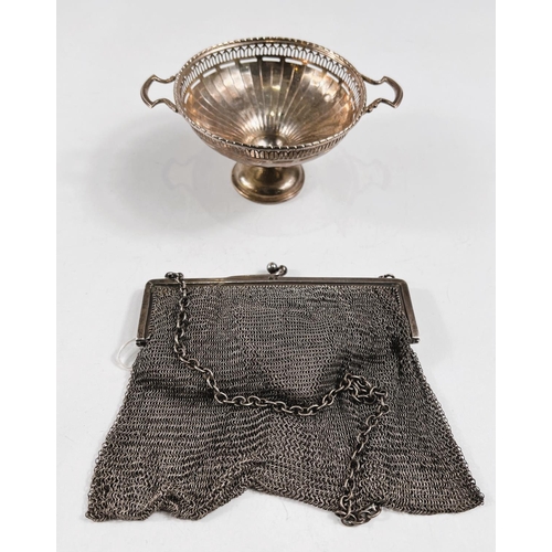 773 - A hallmarked silver circular bonbon dish on pedestal base with twin handles, pierced rim and ribbed ... 