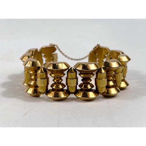 798 - A 'Machine Age' wide chunky bracelet, formed from rose and yellow metal spindle links, stamped 'Rosa... 