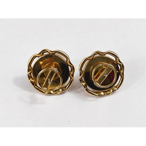 799 - A yellow metal pair of pierced earrings set with large mabe pearls in pierced surround with solid ba... 