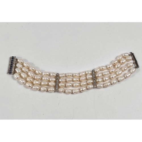 801 - A bracelet formed from 4 rows of fresh water pearls, the vertical clasp and 2 bars set 44 white &... 