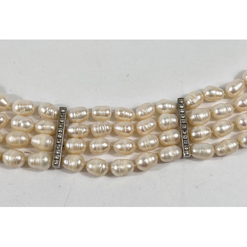 801 - A bracelet formed from 4 rows of fresh water pearls, the vertical clasp and 2 bars set 44 white &... 