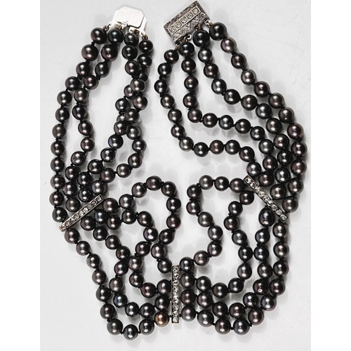 802 - A choker necklace formed from 4 strands of black pearls, 3 vertical decorative bars each set 9 old c... 