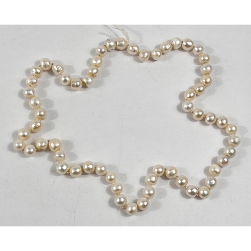 803 - A single strand necklace of 60 pearls, approx, average diameter 10mm, with natural blemishes, length... 