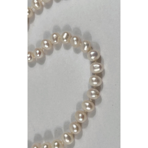 804 - A single strand necklace of 110 pearls, approx, average diameter 7mm, with natural blemishes, length... 