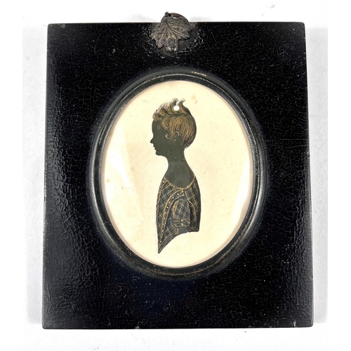 893 - A 19th century silhouette portrait of a young girl in dress with gilt highlights to hair and dress, ... 