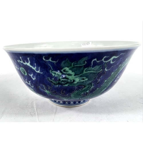 404A - A Chinese mottle blue ground bowl with green dragon decoration, bearing seal mark to base, diameter ... 