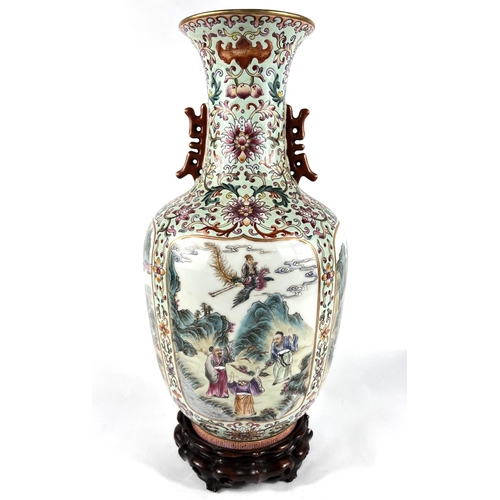 406A - A Chinese famille rose vase with four detailed panels of deities, green glaze, 6 character mark to b... 