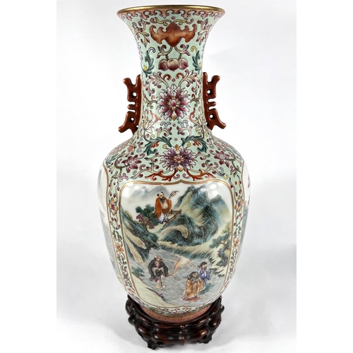 406A - A Chinese famille rose vase with four detailed panels of deities, green glaze, 6 character mark to b... 