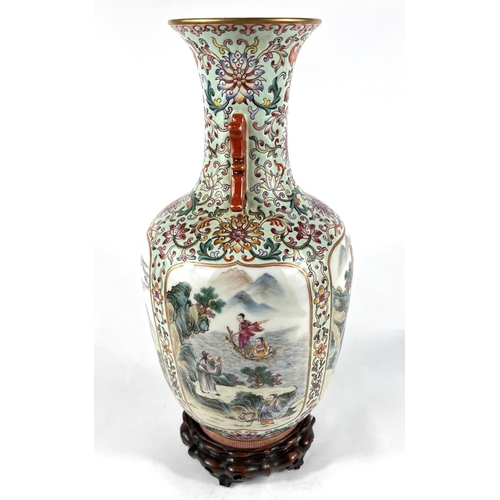 406A - A Chinese famille rose vase with four detailed panels of deities, green glaze, 6 character mark to b... 