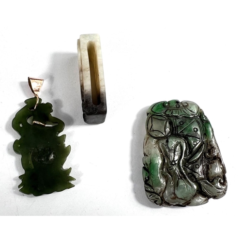 440A - Three Chinese jade coloured hard stone items: One carved belt loop and two pendants, one mounted in ... 