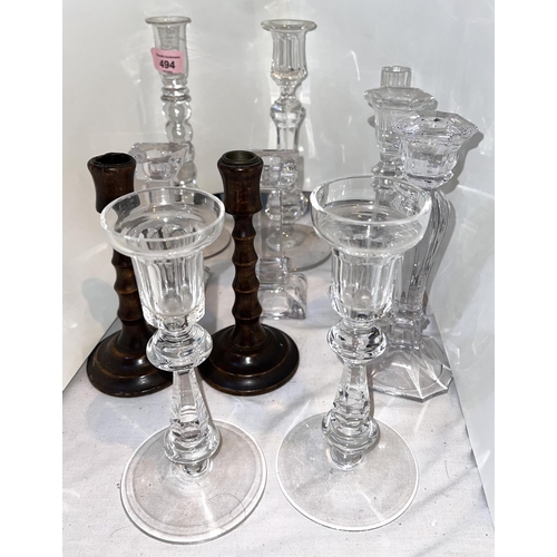 494 - A pair of Waterford cut glass candle sticks with slice cut tops, other various glass and a pair of t... 