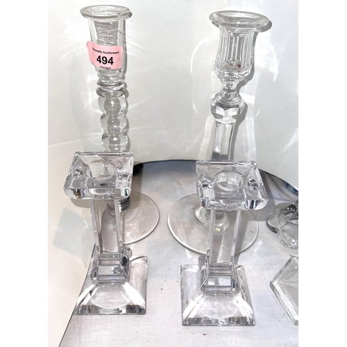 494 - A pair of Waterford cut glass candle sticks with slice cut tops, other various glass and a pair of t... 