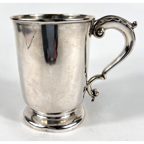 630 - A hallmarked silver 1 pint mug on circular foot with 'S' scroll handle, monogrammed, 9.5oz., height ... 