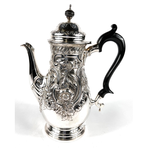 633 - A Georgian style hallmarked silver coffee opt of baluster form with domed lid, extensive scroll and ... 