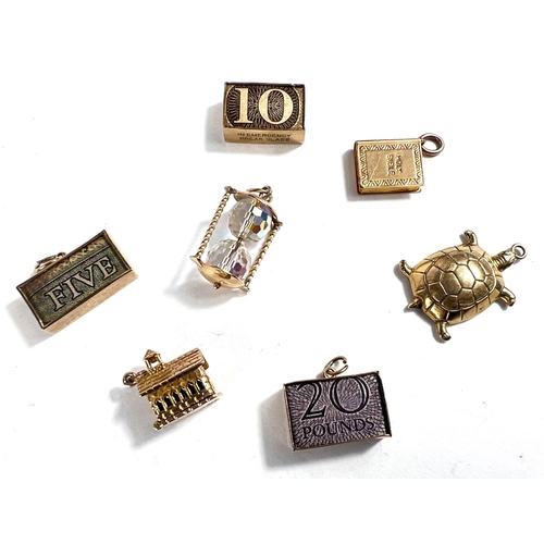 636 - Seven various 9 carat hallmarked gold charms including £5, £10, £20 notes, folded,... 