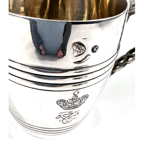 704 - An unusual Middle Easten white metal covered mug in the form of a barrel with sitting duck finial, p... 