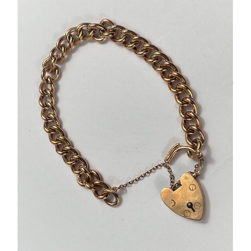 655 - A 9 carat hallmarked gold curb link bracelet with 9 carat hallmarked gold heart lock, 30gm