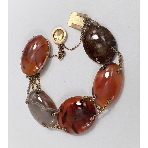 665 - A bracelet formed from oval multicoloured polished agate links, unmarked, clasp tests as circa 9 car... 