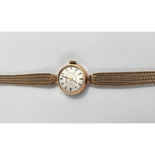 676 - A lady's Roamer wristwatch in 9 carat hallmarked gold, on woven 9 carat strap, 15gm gross weight