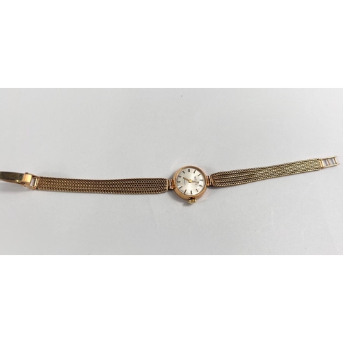 676 - A lady's Roamer wristwatch in 9 carat hallmarked gold, on woven 9 carat strap, 15gm gross weight