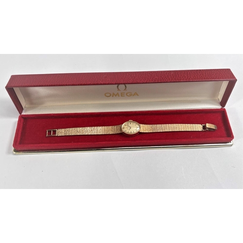 678 - A lady's Omega 9 carat hallmarked gold wristwatch on 9 carat hallmarked gold bark effect bracelet, 2... 