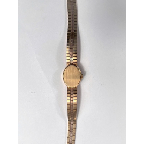 678 - A lady's Omega 9 carat hallmarked gold wristwatch on 9 carat hallmarked gold bark effect bracelet, 2... 