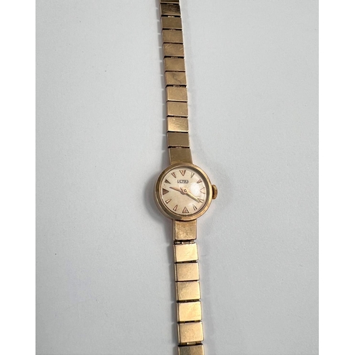 688 - A lady's 9 carat hallmarked gold 'Ultra' wristwatch on 9 carat hallmarked gold rectangular link brac... 