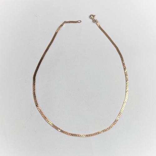 689 - A 9 carat hallmarked gold necklace formed from flattened curb links, 6.4gm.  15 inches long.