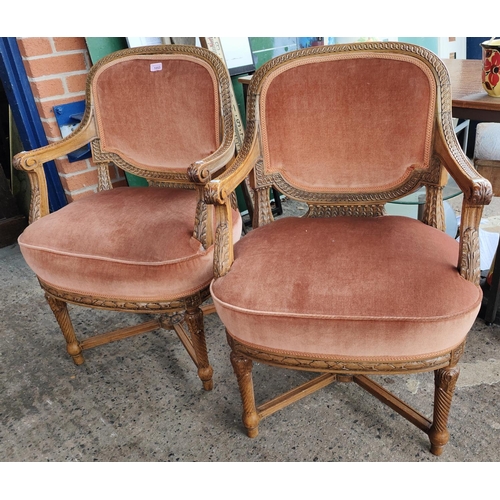 1053 - A pair of French armchairs with carved decoration, rope twist legs x-frame