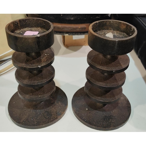 160 - A pair of cast iron candlesticks by Robert Welch