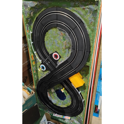 196 - A Radio Shack slot racing game with 2 cars, mounted on scenic board