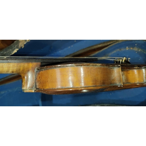 339 - A late 19th early 20th century two piece back violin, stamped Stainer to the reverse, with scrolling... 