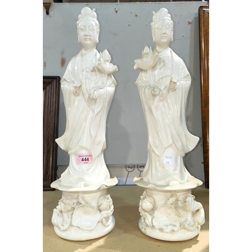 444 - A pair of late 19th / early 20th century Chinese blanc de chine figures of deities standing with pla... 