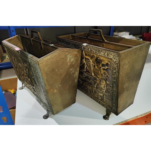 79 - Two embossed brass magazine racks & metalware.