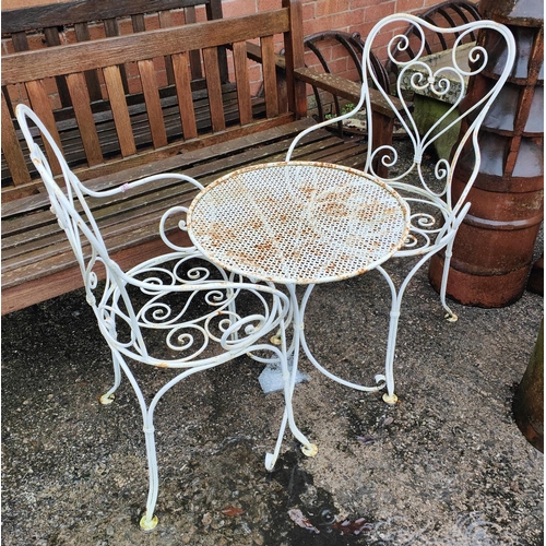 962 - A patio set comprising 2 wrought iron chairs & table