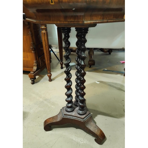 973 - A Victorian rosewood octagonal work table with inlaid and fitted interior, on triple barley twist le... 